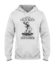 Never underestimate a man loves golf - November Hooded Sweatshirt front