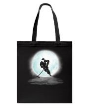 Playing hockey under the moon Tote Bag thumbnail