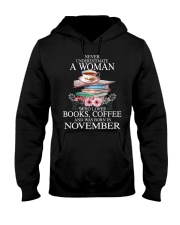 books never underestimate November Hooded Sweatshirt front