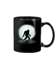 Funny bigfoot hand gesture under the moon Mug thumbnail
