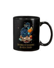 In a world of bookworms be a book dragon Mug tile