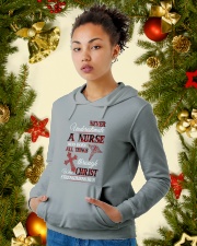 Never Underestimate A Nurse Who Does All Things Hooded Sweatshirt lifestyle-holiday-hoodie-front-4