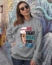 WE FIGHT WHAT YOU FEAR Crewneck Sweatshirt lifestyle-unisex-sweatshirt-front-3
