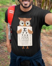 Awesome t-shirt design that features an owl wearing glasses and holding an eye chart. Classic T-Shirt custom-t-shirts-classic-lifestyle-front-384