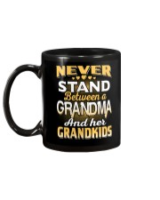 Between Grandma And Grandkids Mug back