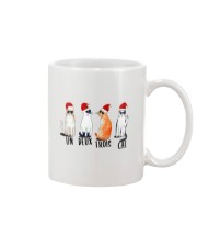 UN DEUS TROIS Mug tile