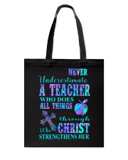 Never underestimate a teacher Tote Bag tile