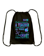 Never underestimate a teacher Drawstring Bag tile