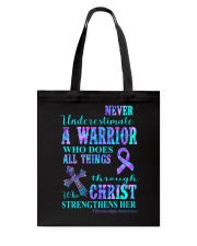 Never underestimate a warrior Tote Bag tile
