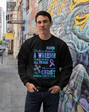 Never underestimate a warrior Crewneck Sweatshirt lifestyle-unisex-sweatshirt-front-2