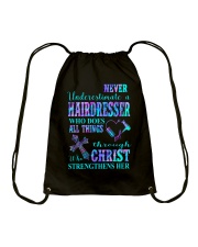 Never underestimate a hairdresser Drawstring Bag tile