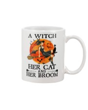 A Witch Her Cat and Her Broom Mug front