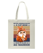 Never underestimate a cat mom Tote Bag tile