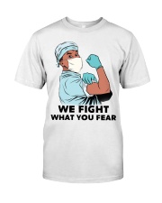 We Fight What You Fear Male Nurse Fighting Virus Premium Fit Mens Tee tile