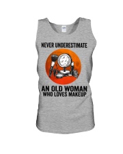 Makeup Never underestimate an old woman Unisex Tank tile