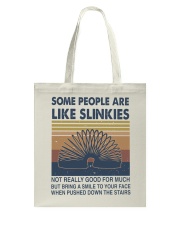 Some People Are Like Slinkies Tote Bag tile