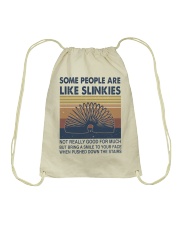 Some People Are Like Slinkies Drawstring Bag tile