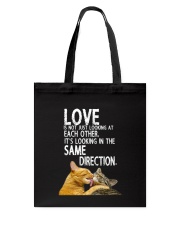 love is not looking at each other it's looking in Tote Bag tile