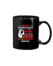 Never Underestimate A Nurse Mug thumbnail