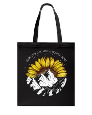 Begin each day Tote Bag tile