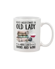 An old lady who loves books and wine Mug tile