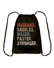 Husband-Daddles-Bigger-Faster-Stronger Drawstring Bag tile