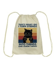 That's what I do I turn strings Drawstring Bag tile