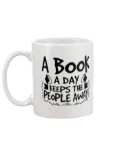 A Book A Day Keeps The People Away Mug back