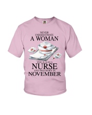 nurse a woman November Youth T-Shirt tile