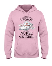 nurse a woman November Hooded Sweatshirt tile