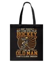 Old man play hockey Tote Bag tile
