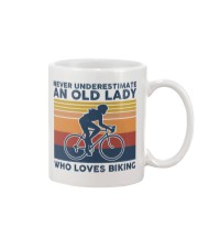 Never Underestimate An Old Lady Who Loves Biking Mug tile