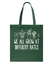 WE ALL GROW AT Tote Bag tile