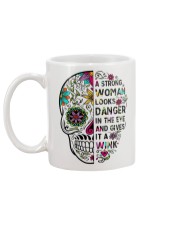 A strong women looks Mug back