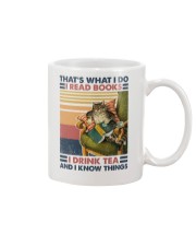 Cat Reads Book Drinks Tea and Knows Things Mug tile