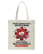 Never underestimate Books December Tote Bag tile