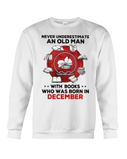 Never underestimate Books December Crewneck Sweatshirt tile