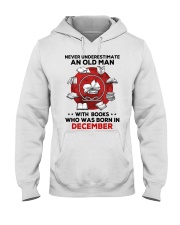 Never underestimate Books December Hooded Sweatshirt tile