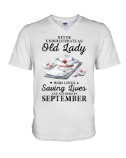 never underestimate an old lady September nurse V-Neck T-Shirt tile
