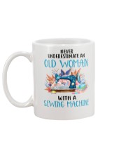 An Old Woman With A Sew Machine Mug back