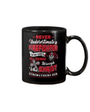 Never Underestimate A Firefighter Mug thumbnail