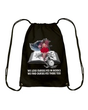 We lose ourselves in books Drawstring Bag tile