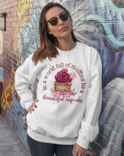 In a world full of muffins Crewneck Sweatshirt lifestyle-unisex-sweatshirt-front-3