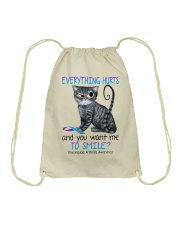 Everything hurts and you want me to smile Drawstring Bag tile