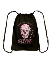 Death smiles at everyone this pink warrior Drawstring Bag tile