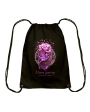 Never give up Drawstring Bag tile