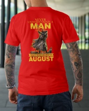 NEVER UNDERESTIMATE A MAN OF FAITH - AUGUST Classic T-Shirt lifestyle-mens-crewneck-back-3