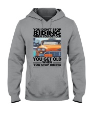 taxi driver riding Hooded Sweatshirt tile