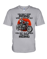 biker riding V-Neck T-Shirt tile